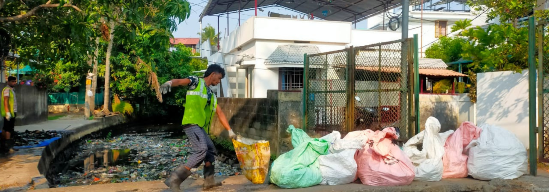 Riverrecycle team cleaning a canal in Kochi, India